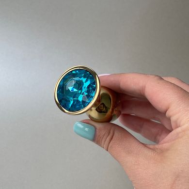Золота анальна пробка з блакитним кристалом (2,8 см) - фото